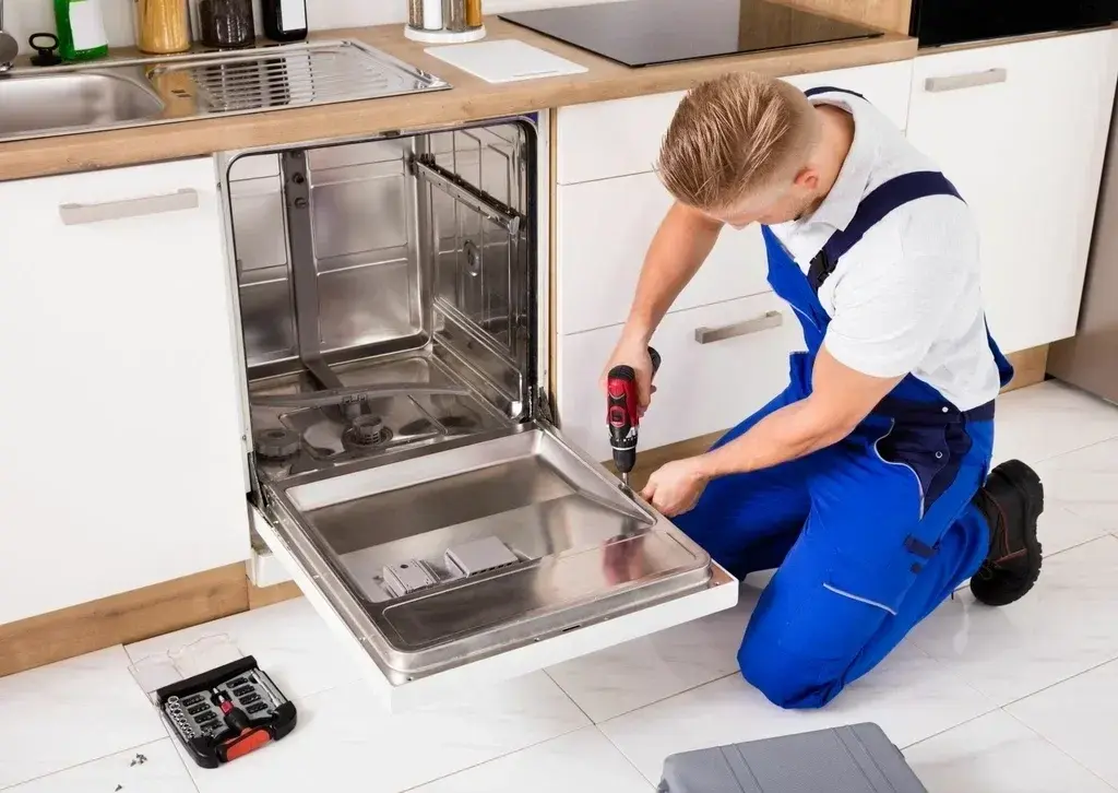Dishwasher leak repair technician checking a leaking dishwasher in Philadelphia PA