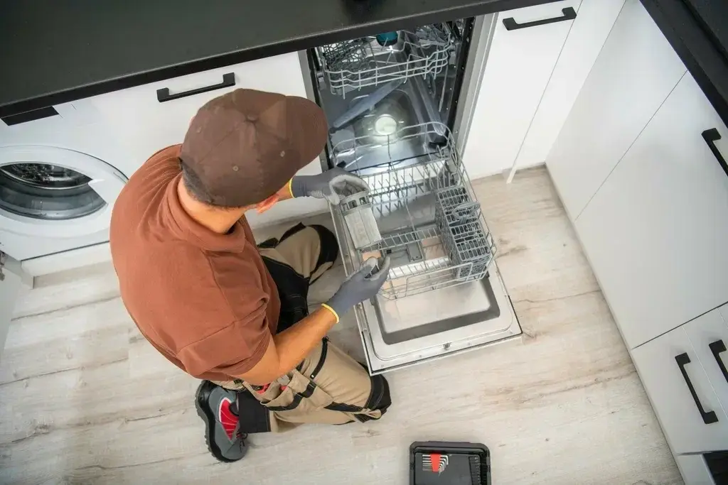 Dishwasher not cleaning properly repair technician inspecting a dishwasher in Philadelphia PA