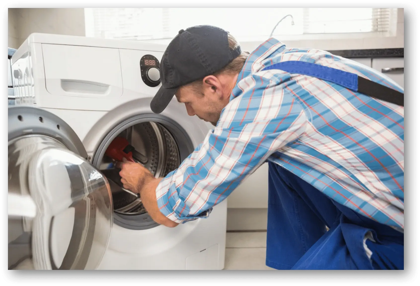 Dryer repair technician fixing a dryer in Philadelphia PA