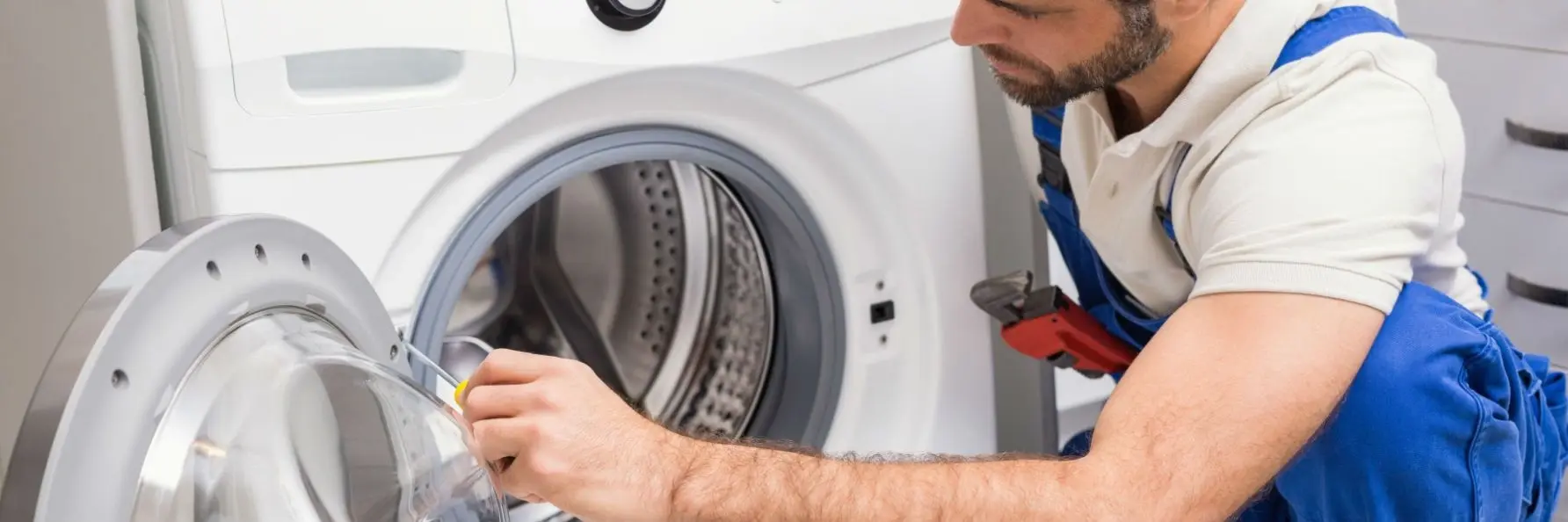 Professional dryer repair technician checking a dryer in Philadelphia PA