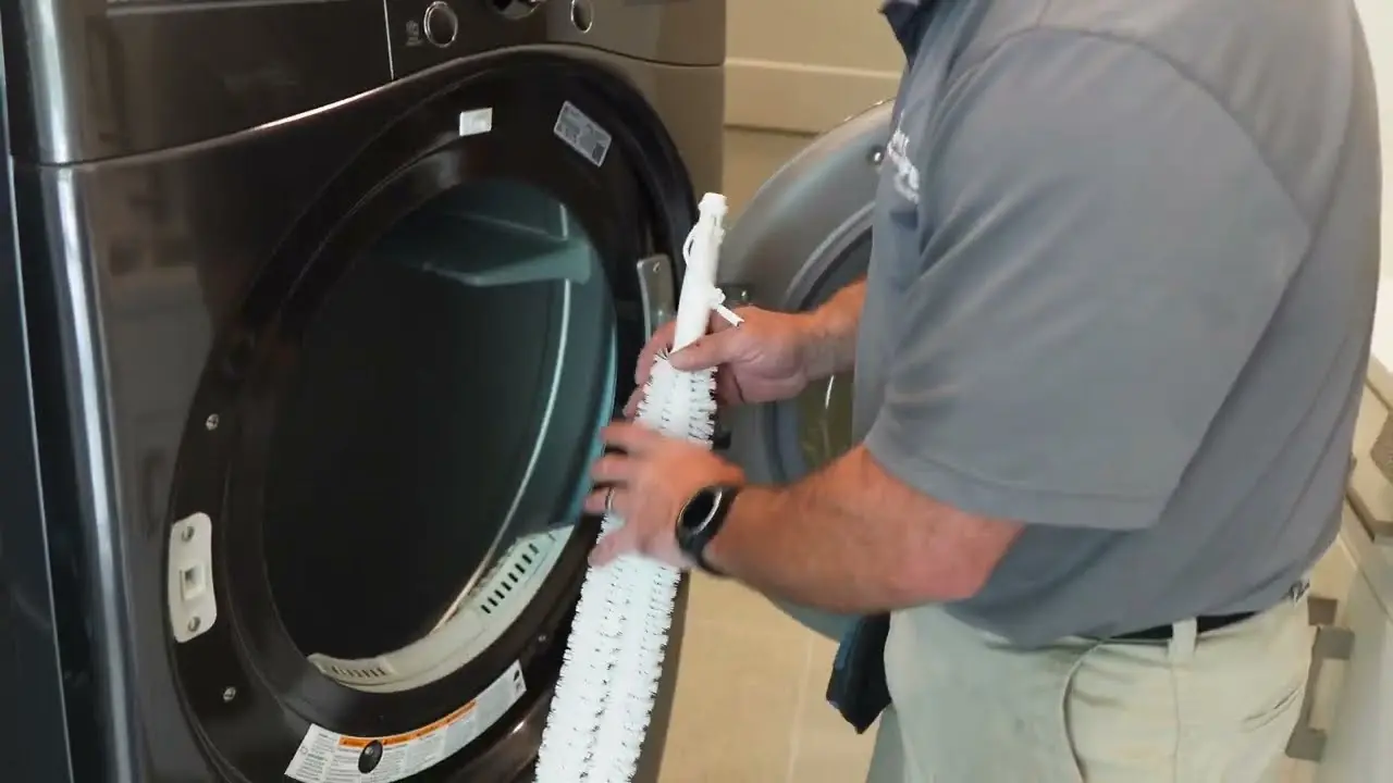 Residential dryer repair technician checking a dryer in Philadelphia PA