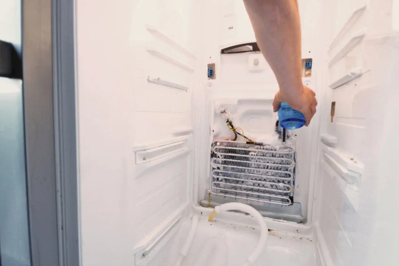 Same-day refrigerator repair technician checking a fridge in Philadelphia PA