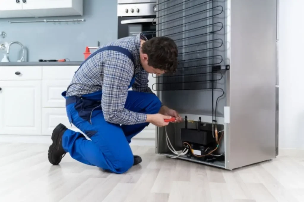Refrigerator door seal repair technician checking a fridge gasket in Philadelphia PA