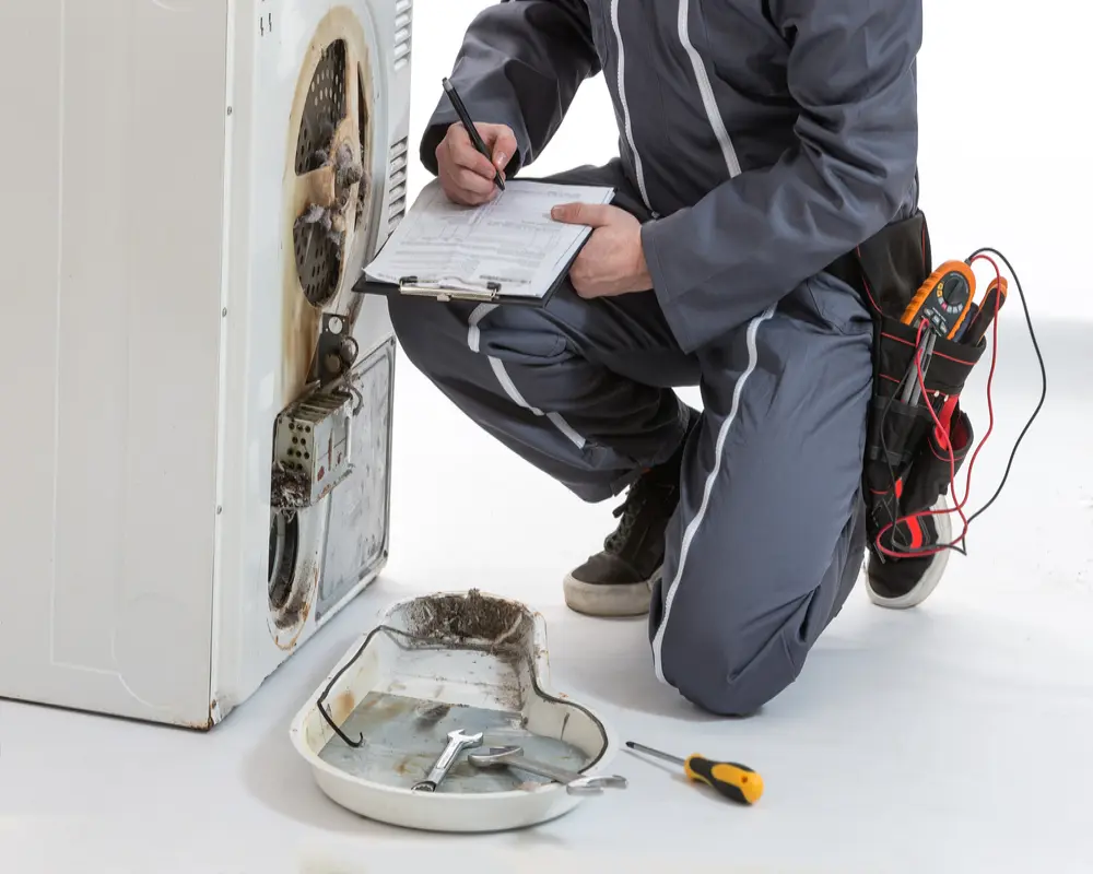 Appliance repair technician servicing a Philadelphia rental unit