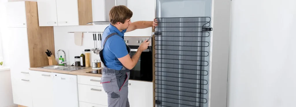 Chest freezer repair technician inspecting a freezer in Philadelphia PA