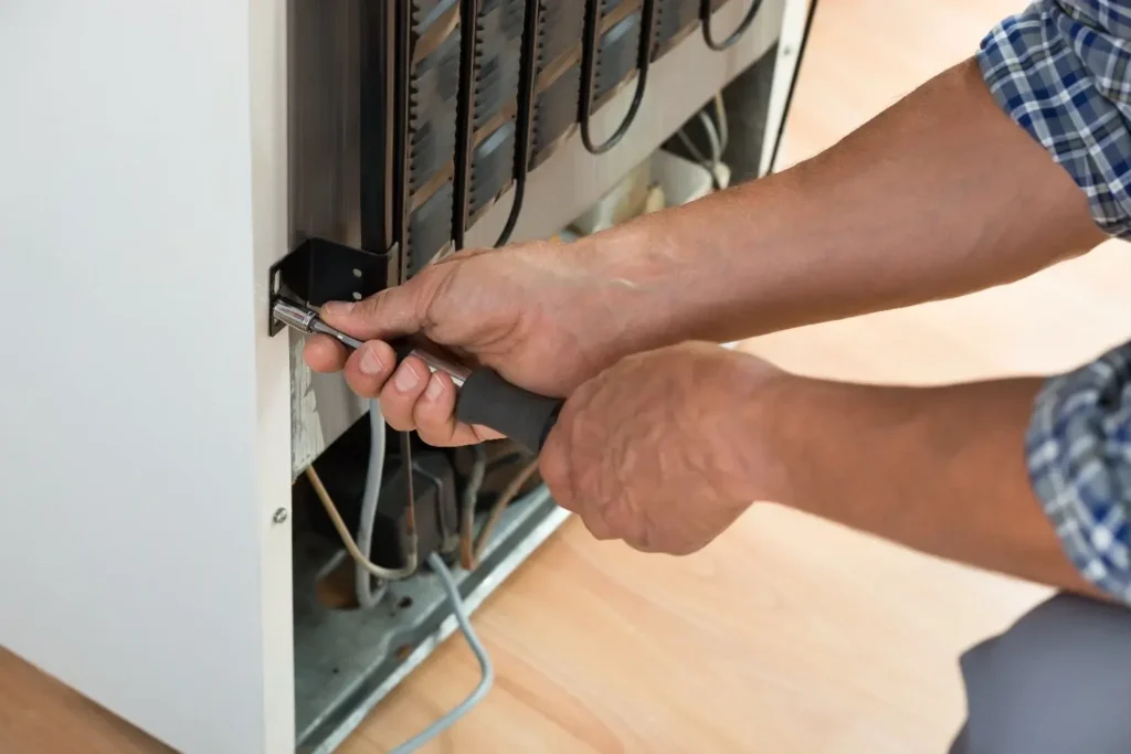 Freezer door seal repair technician checking a freezer gasket in Philadelphia PA