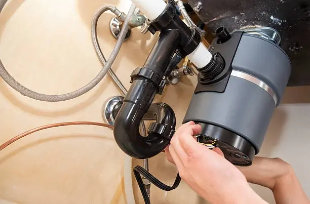 Garbage disposal motor repair under kitchen sink in Philadelphia PA