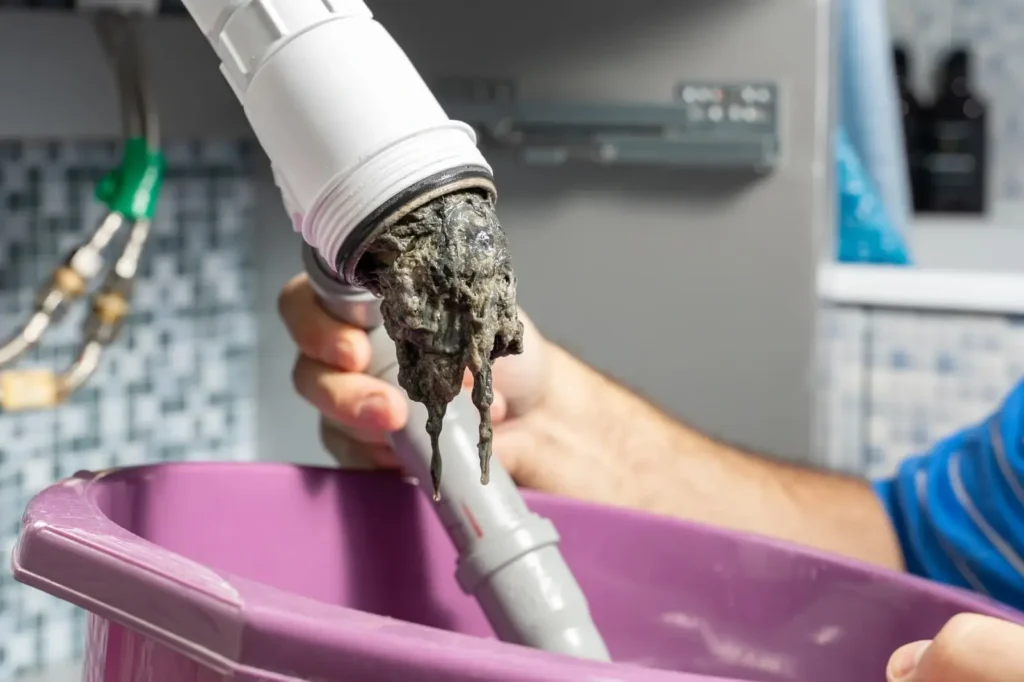 Garbage disposal repair technician fixing a disposal in Philadelphia PA
