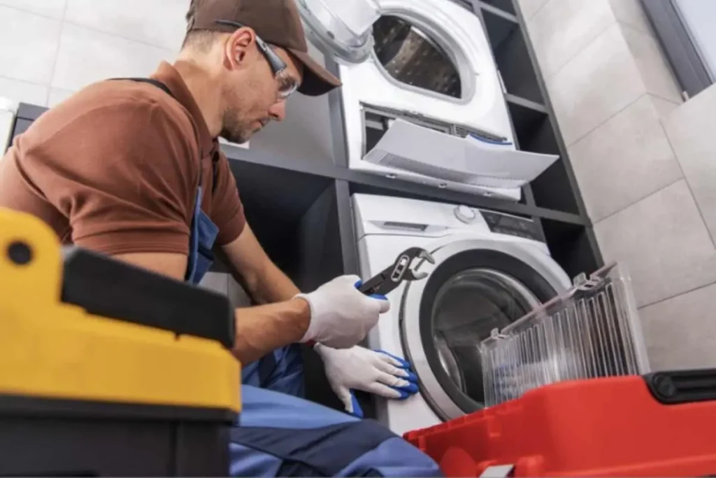 Home appliance service technician checking an appliance in Philadelphia PA