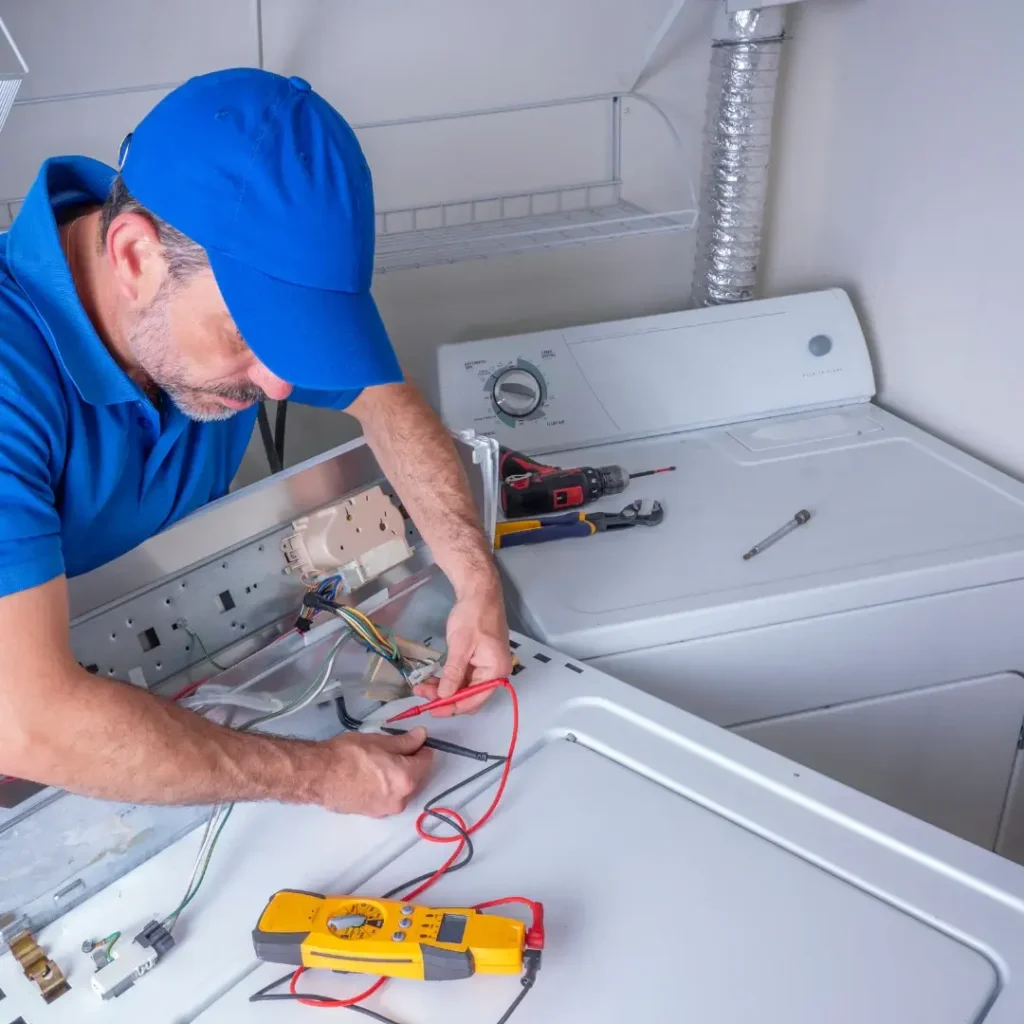In home appliance repair technician fixing an appliance in Philadelphia PA