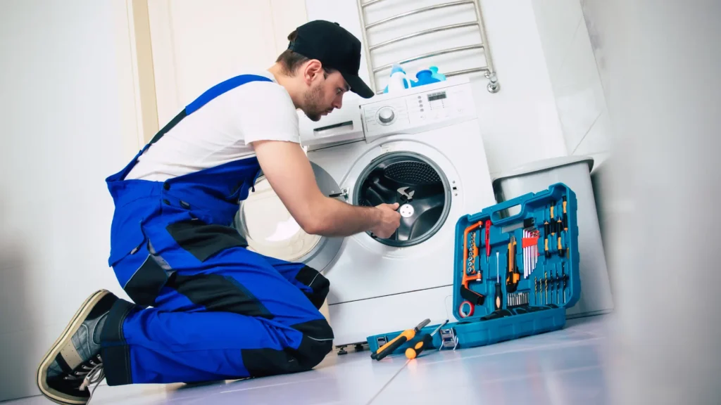 Local home appliance help technician inspecting an appliance in Philadelphia PA
