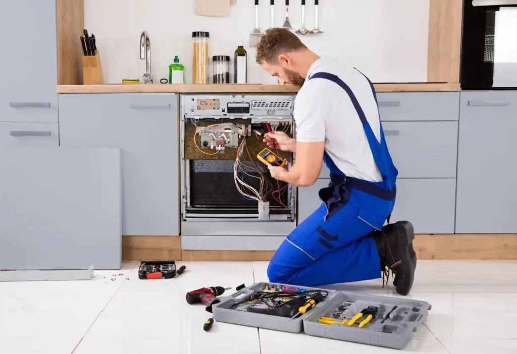Philadelphia PA appliance repair service technician fixing an appliance